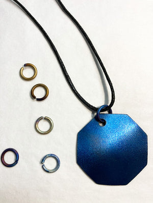 titanium links and using them with a waxed, cotton cord on your pendant
